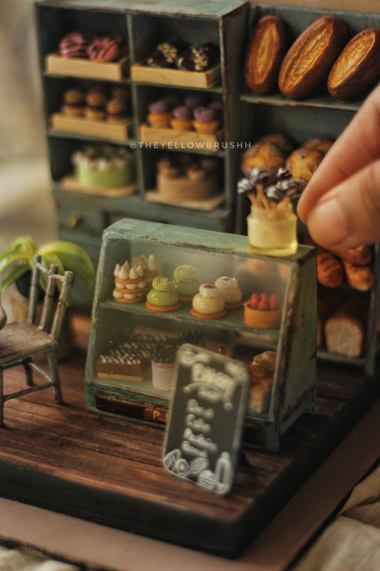 Close-up of miniature bakery café display