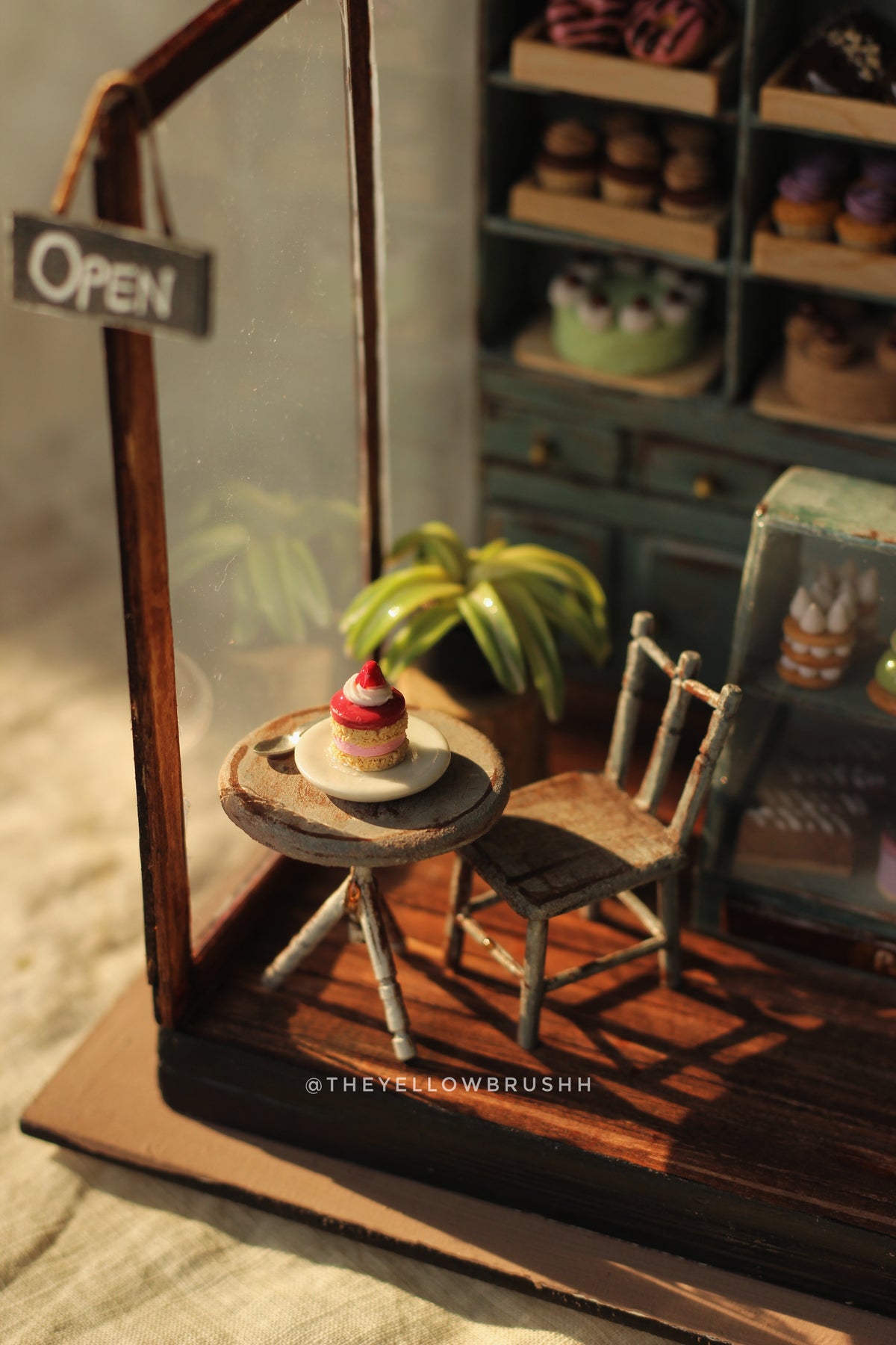 Miniature bakery café display with open sign